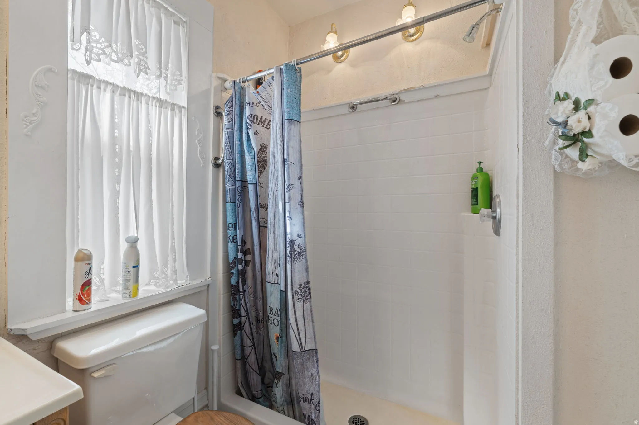 Bathroom with a stall shower and vanity