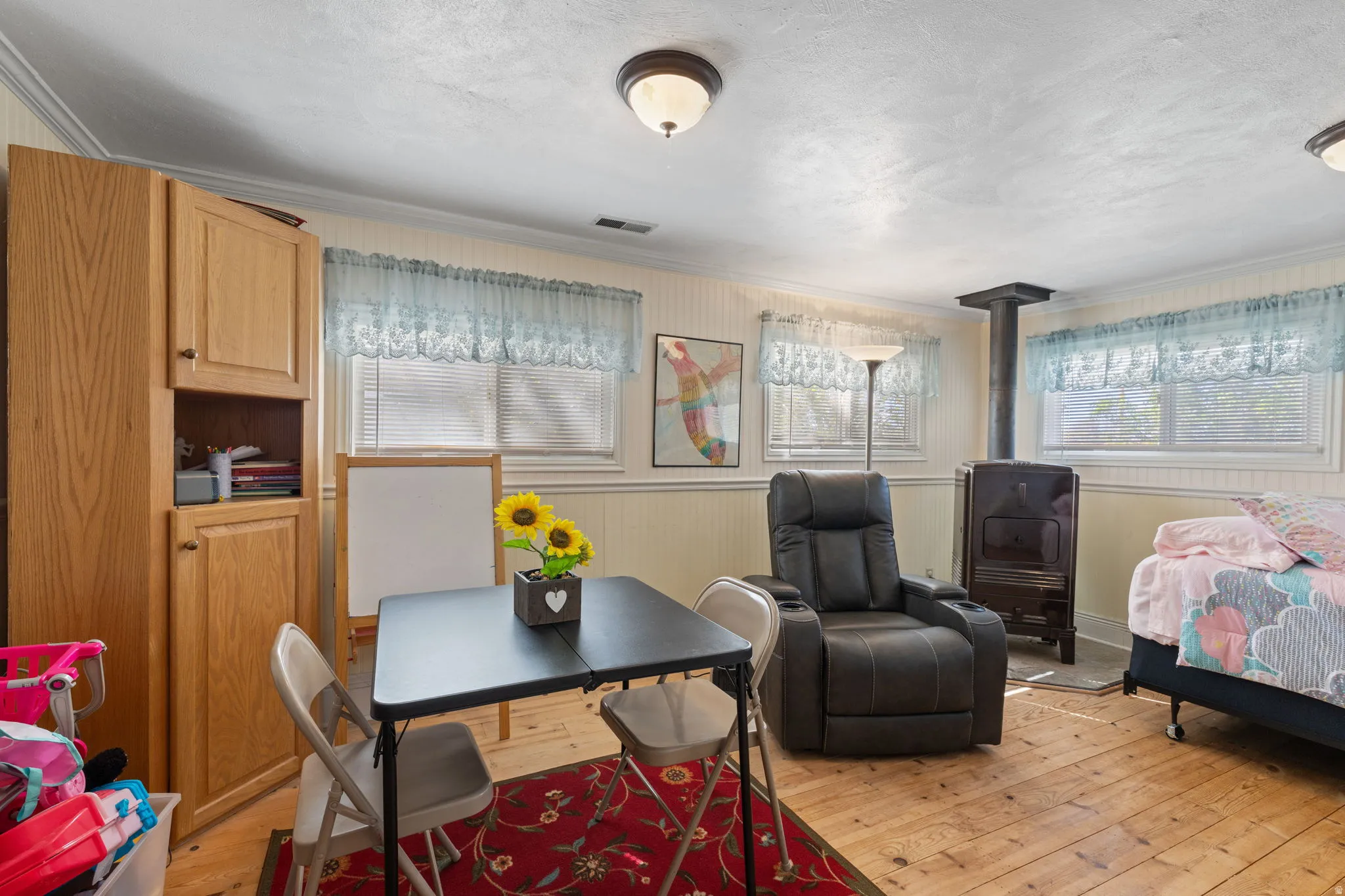 Family room/bonus room with coal/wood burning stove