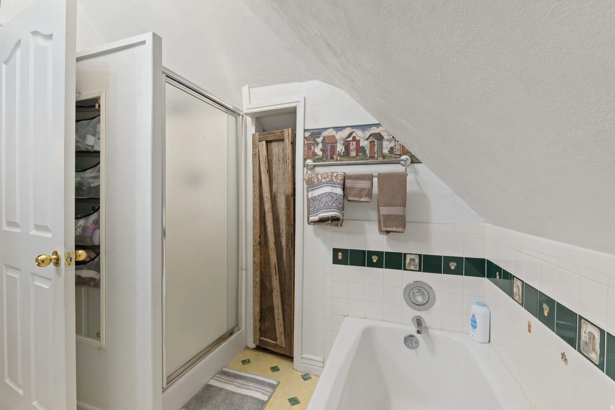Upstairs bathroom with separate tub and shower