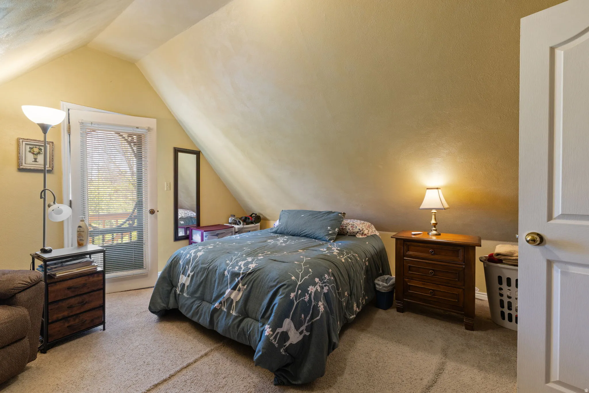 Main upstairs bedroom with outdoor balcony