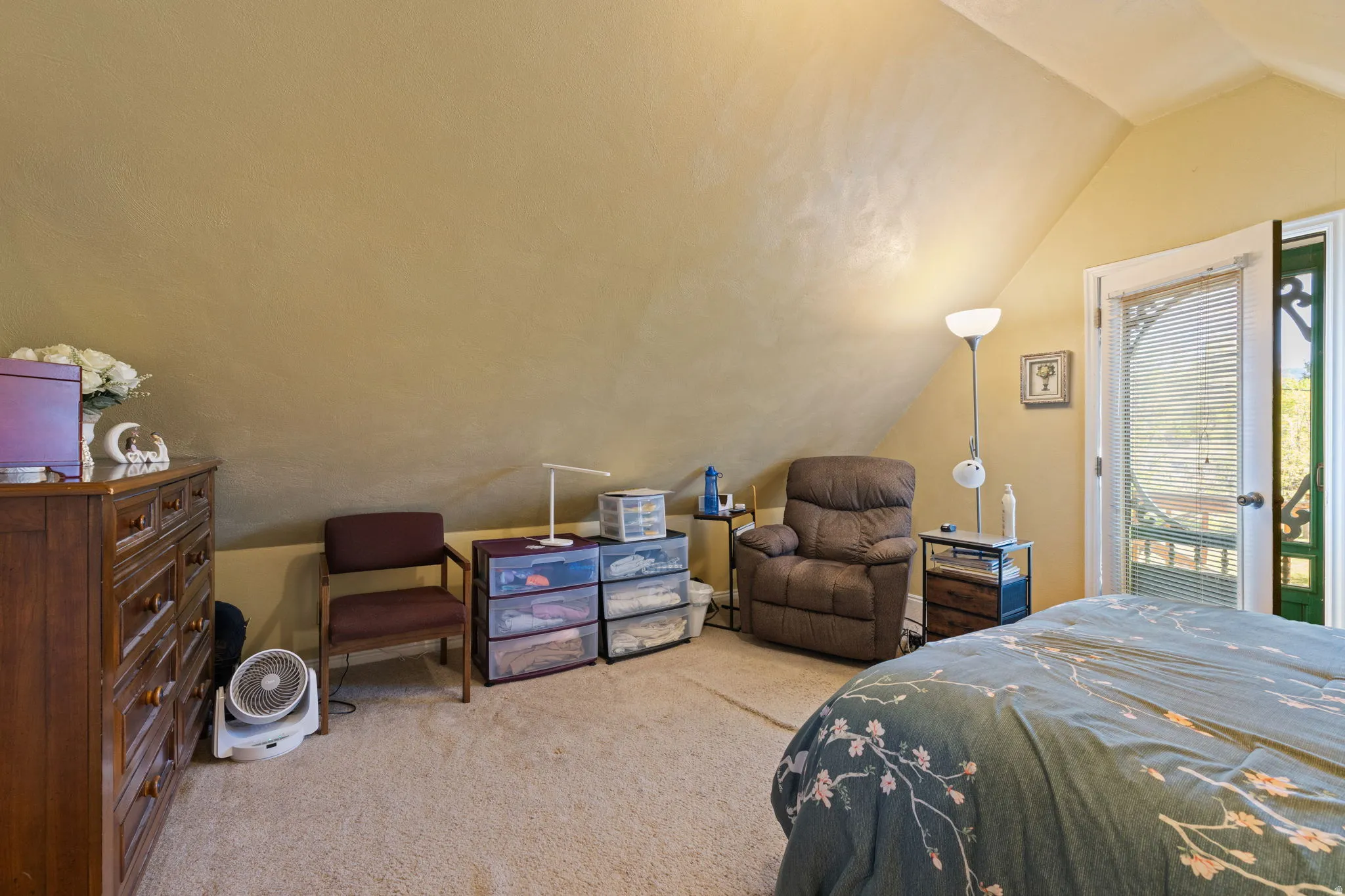 Main upstairs bedroom with outdoor balcony