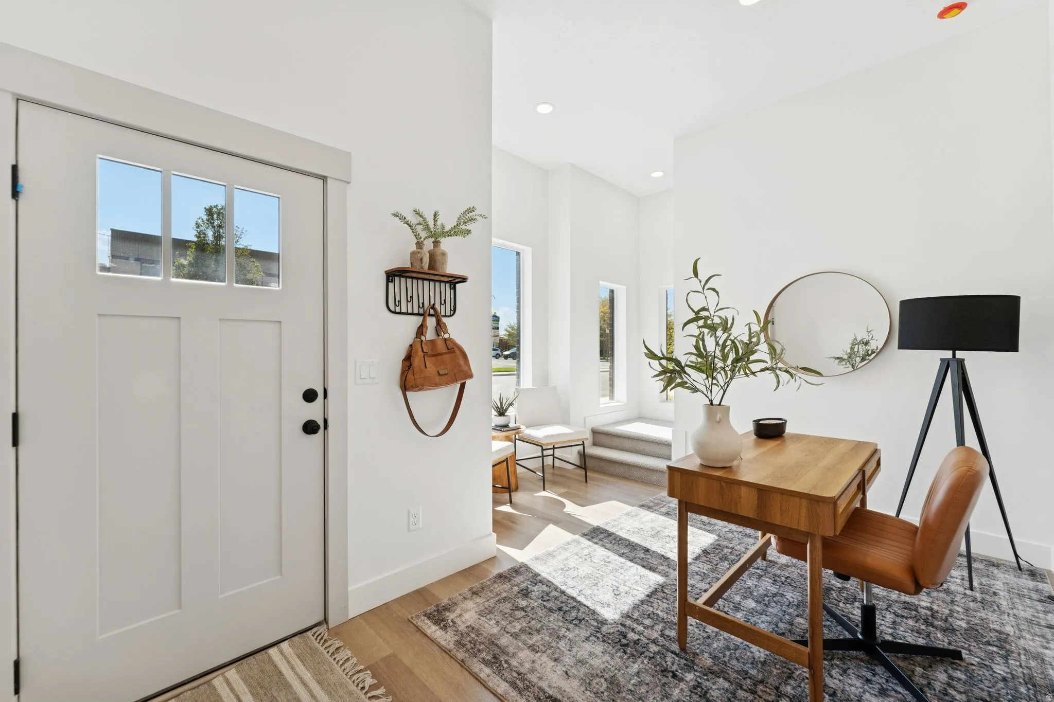 Entrance foyer featuring light wood finished floors and recessed lighting