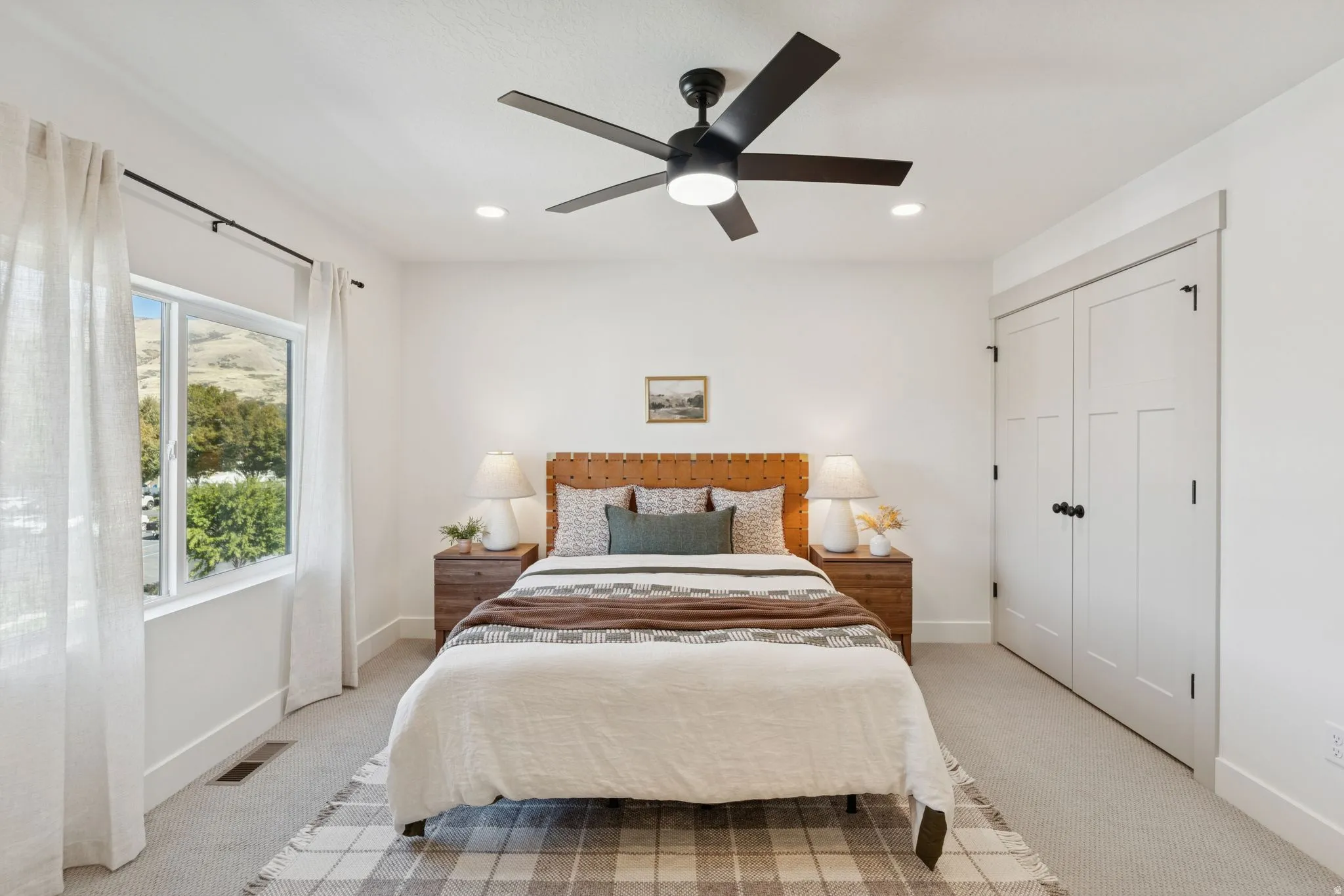 Bedroom featuring light colored carpet, a closet, ceiling fan, and recessed lighting