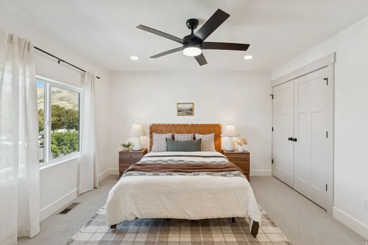 Bedroom featuring light colored carpet, a closet, ceiling fan, and recessed lighting