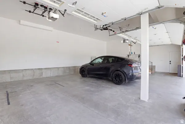 Garage featuring a garage door opener