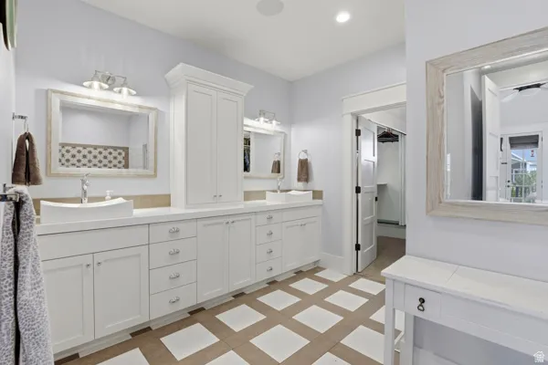 Bathroom featuring double vanity and recessed lighting