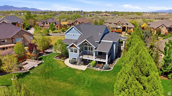 Aerial perspective of suburban area featuring a mountainous background