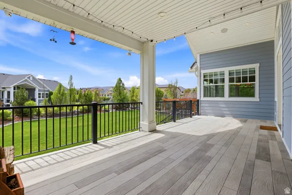 Deck featuring a yard and a residential view