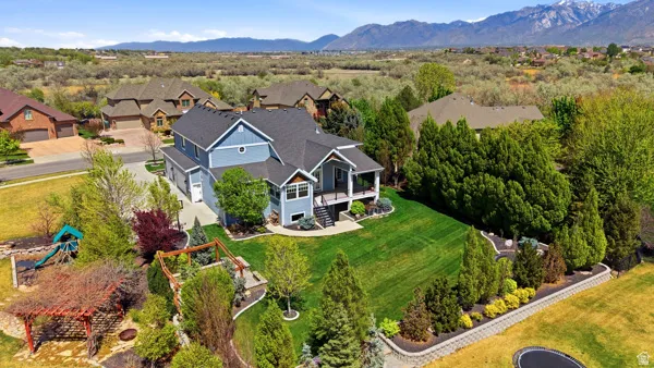 Aerial view of residential area featuring a mountainous background