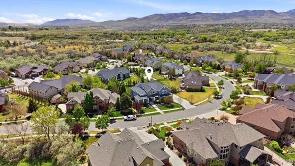 Aerial perspective of suburban area with a mountain backdrop