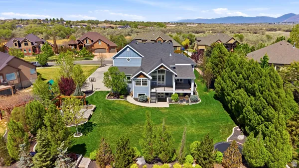 Aerial view of residential area featuring a mountain backdrop