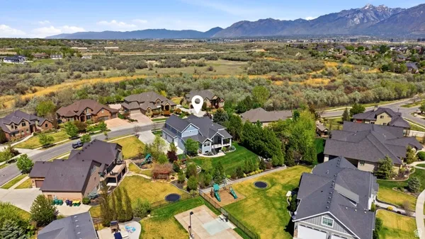 Aerial view of residential area with a mountainous background