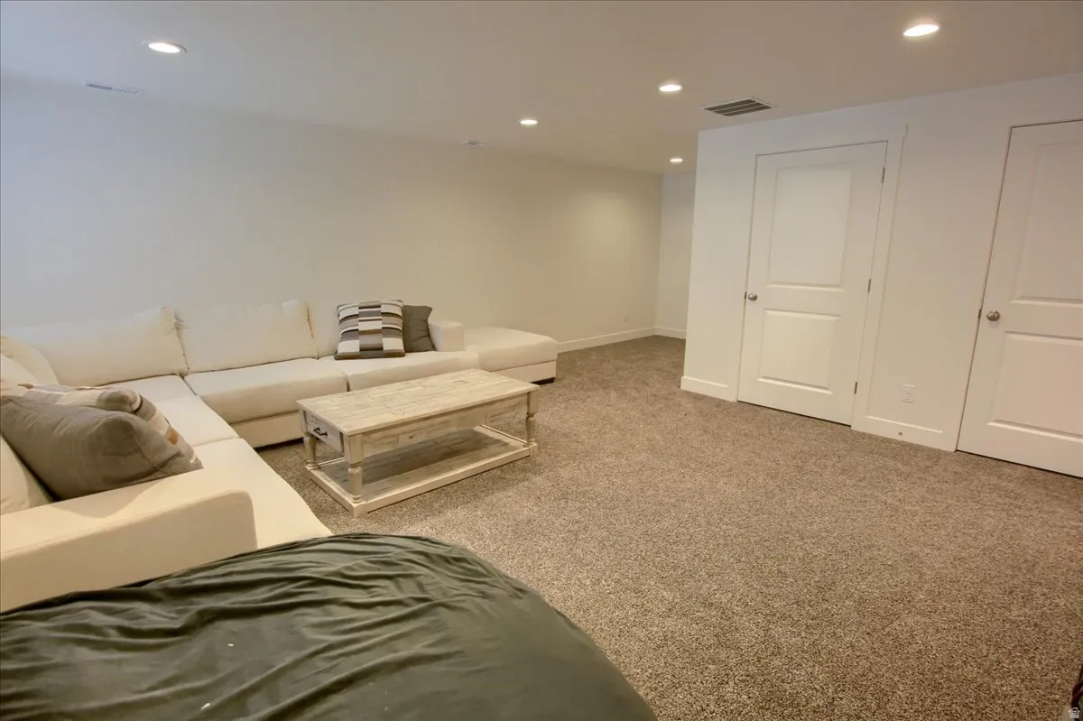 Living room with recessed lighting and carpet flooring