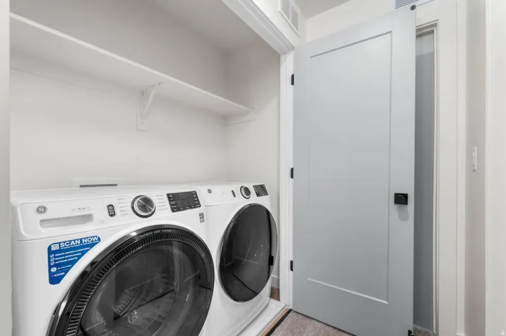 Laundry area featuring separate washer and dryer