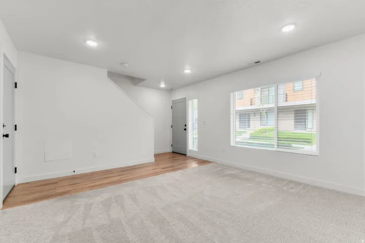 Entryway featuring recessed lighting and light colored carpet