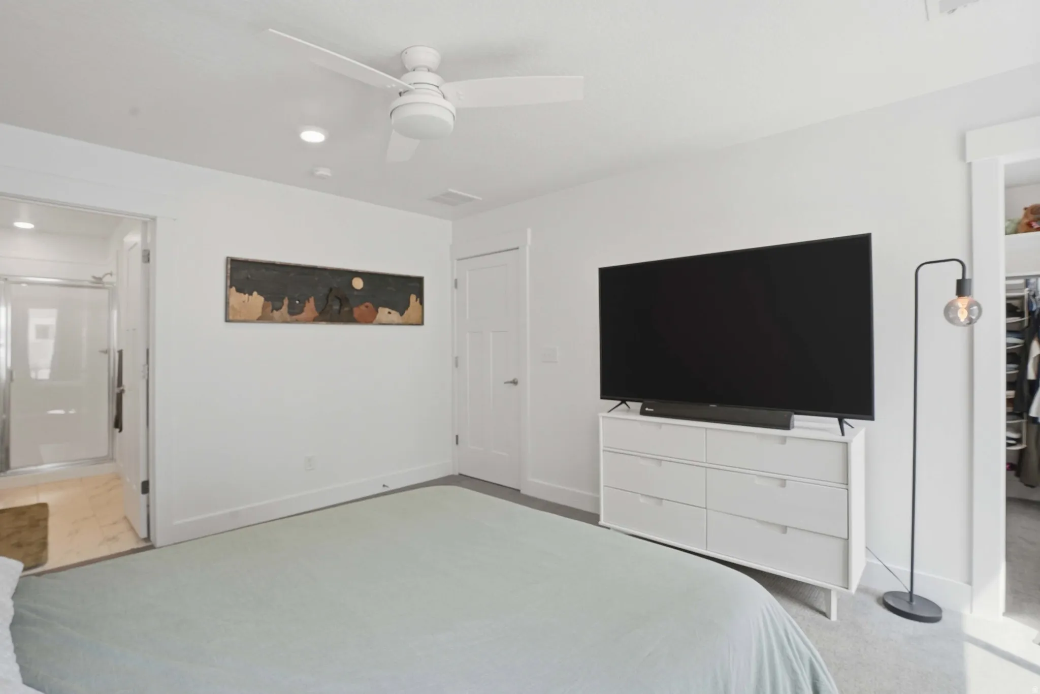 Bedroom featuring a ceiling fan, recessed lighting, and connected bathroom
