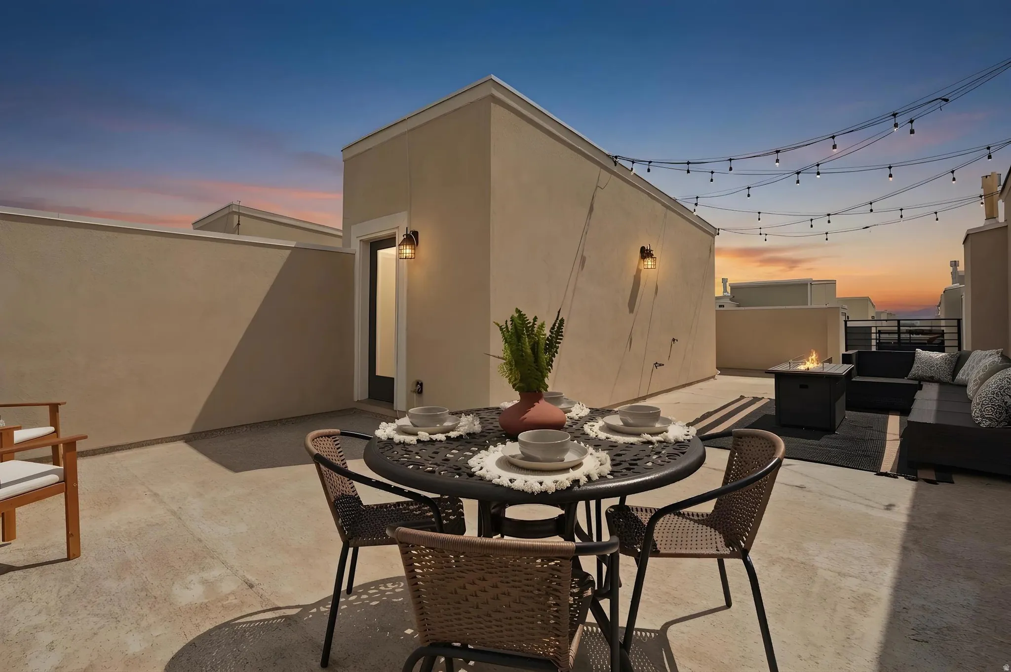 Patio terrace at dusk with outdoor lounge area, a patio area, and an outdoor fire pit