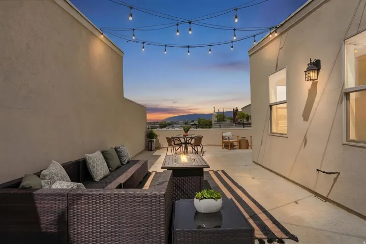 View of patio / terrace with an outdoor living / dining area and an outdoor fire pit