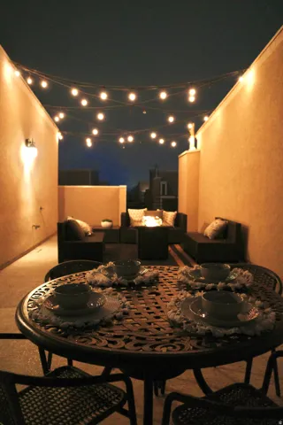 Patio at twilight featuring an outdoor hangout area and a patio