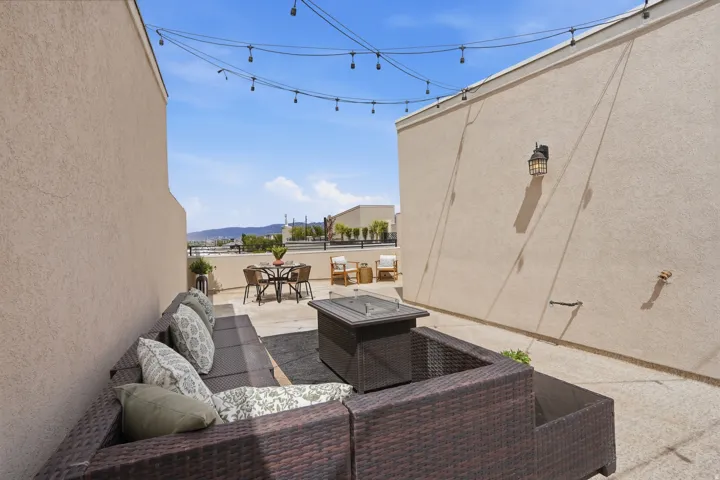 View of patio featuring an outdoor hangout area and a mountain view