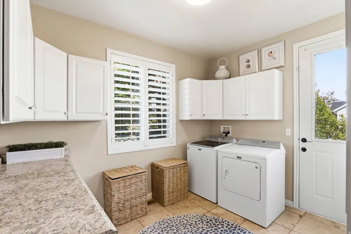 Laundry area with cabinet space and washer and dryer