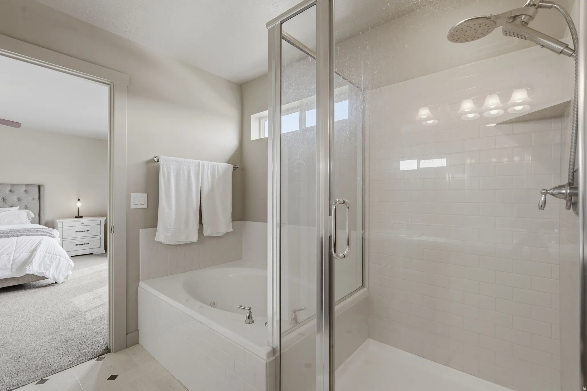 primary bathroom ensuite separate bath and shower