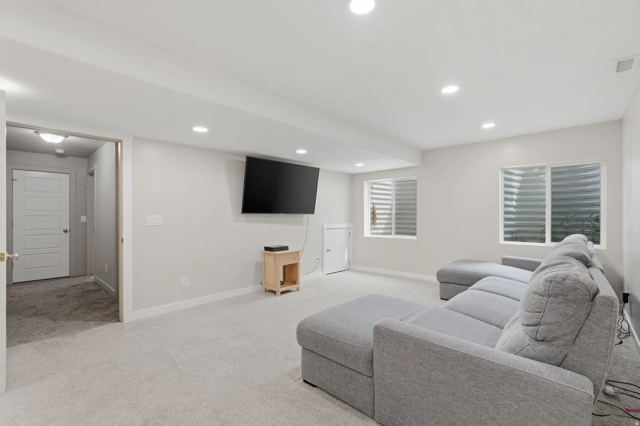 Family room featuring light carpet and recessed lighting