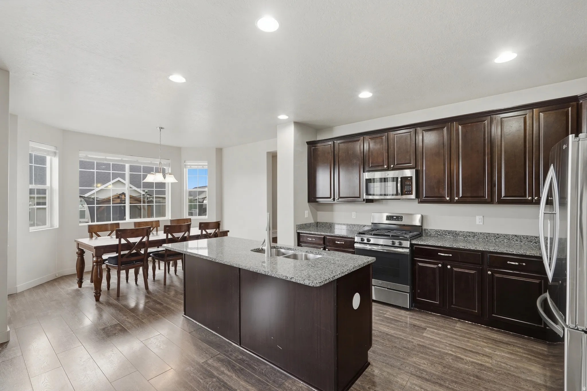 Kitchen featuring stainless steel appliances and dining space