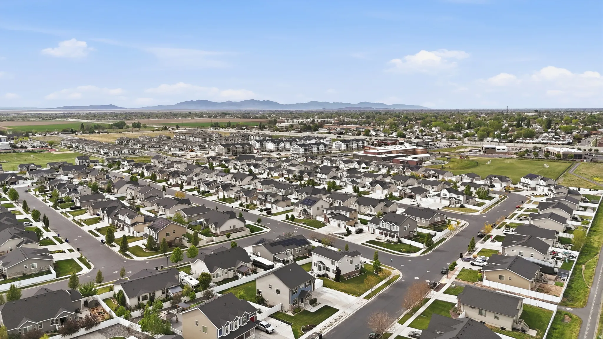 Aerial view of residential area featuring mountains