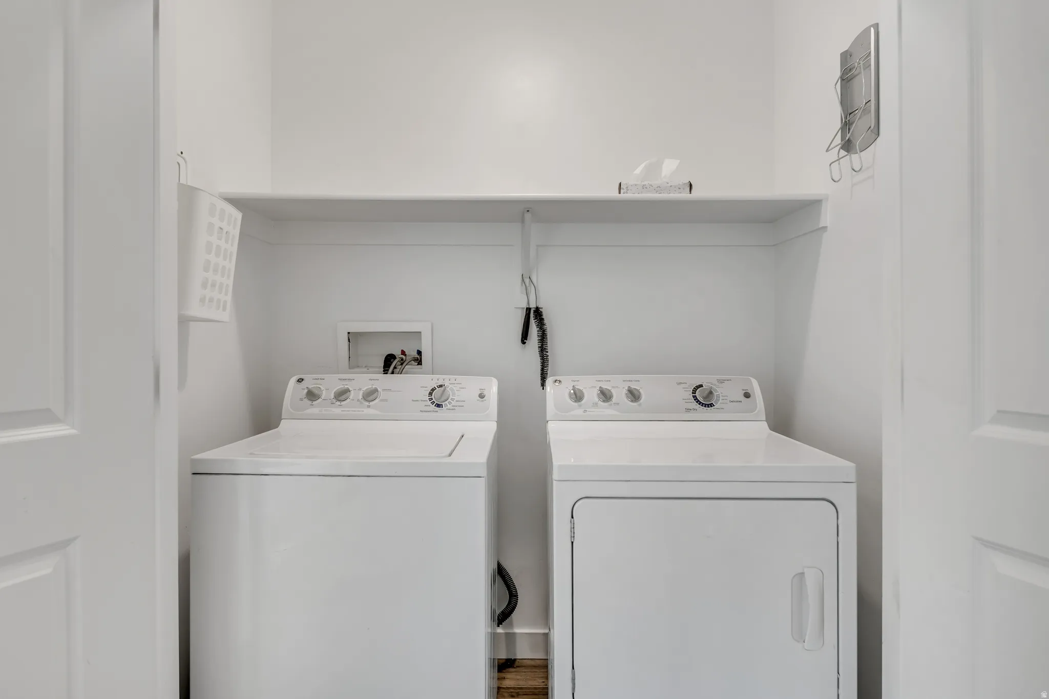Laundry area with washing machine and clothes dryer