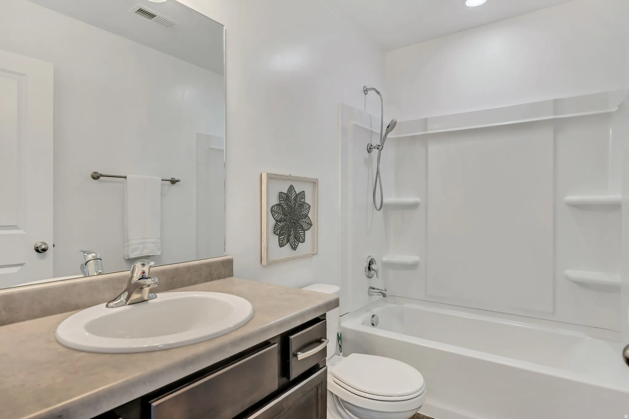 Full bathroom with vanity and shower / bath combination