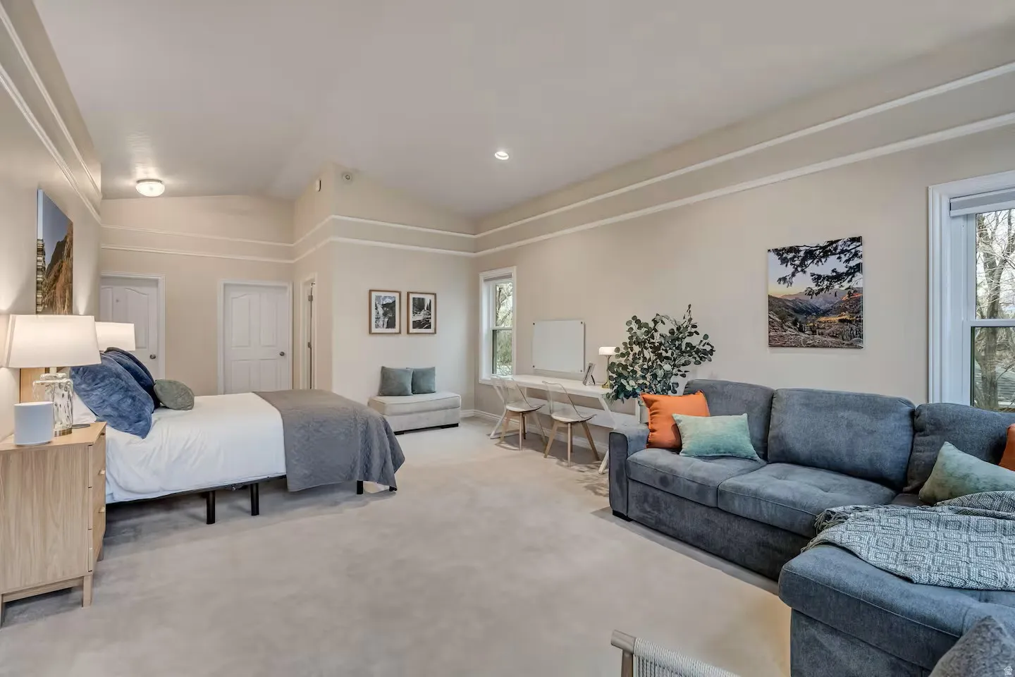 Carpeted bedroom with lofted ceiling and recessed lighting