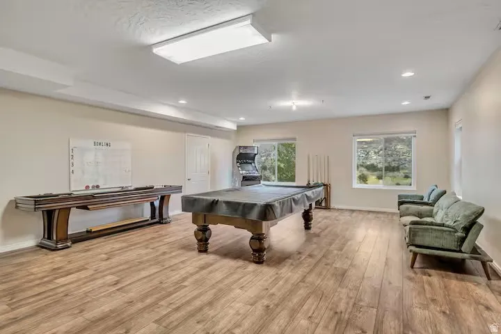 Recreation room with billiards and recessed lighting