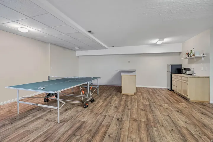 Game room featuring light wood-style flooring and baseboards