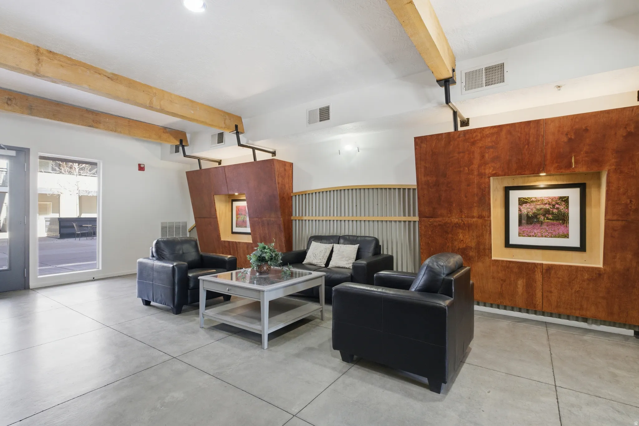 Community lobby featuring beam ceiling