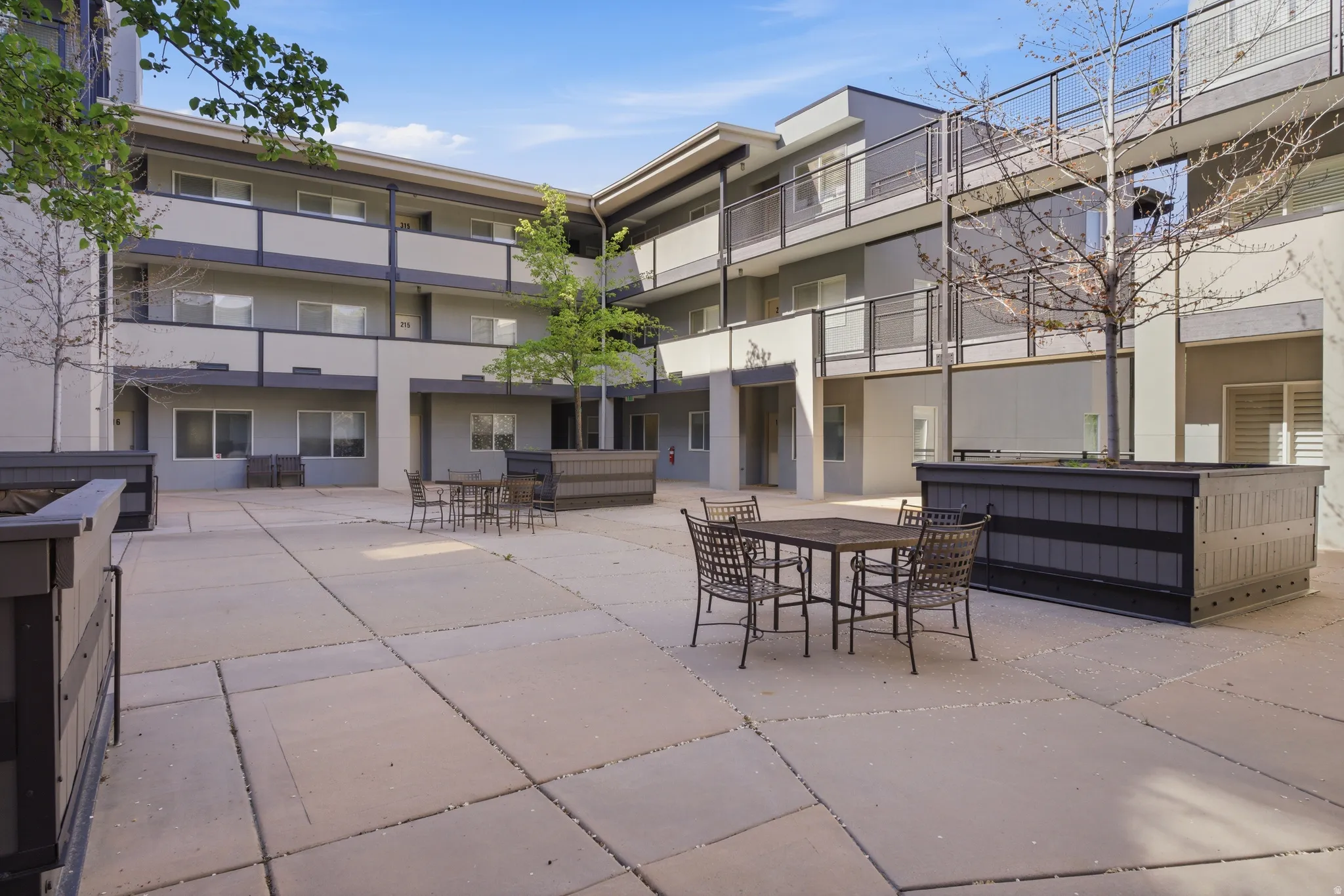 View of courtyard patio featuring outdoor dining areas