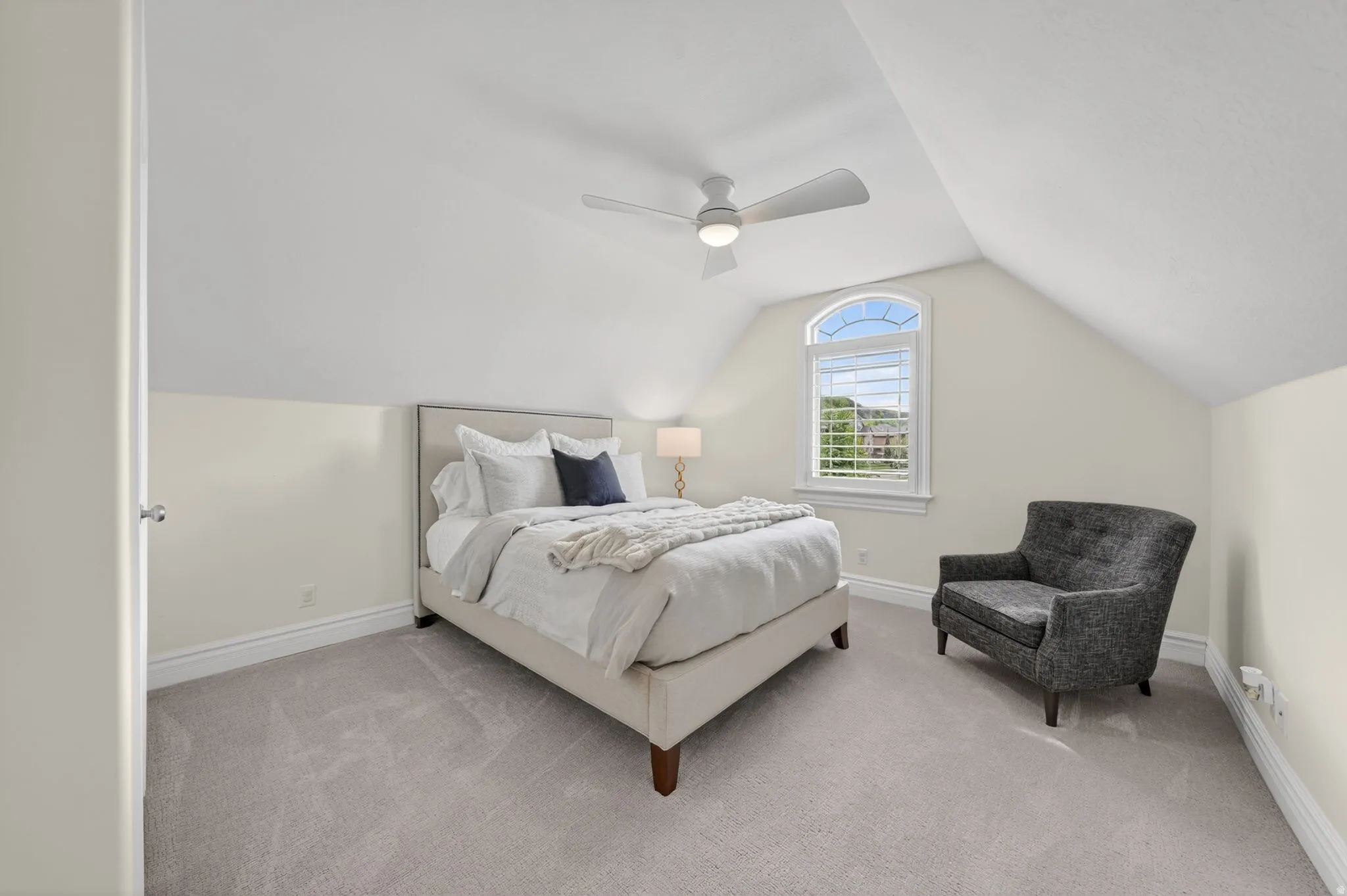 Bedroom with light carpet and ceiling fan