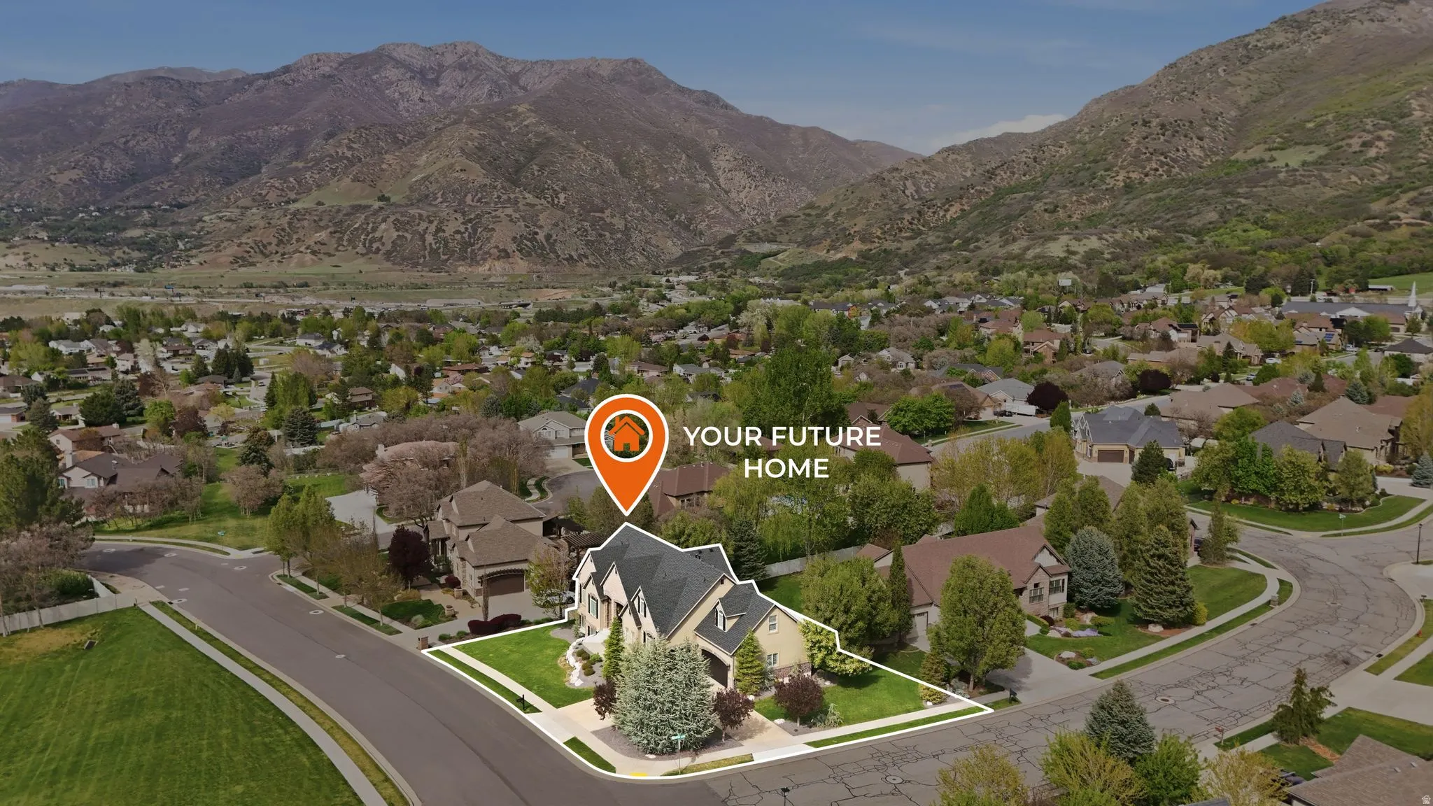 Aerial perspective of suburban area featuring property boundaries highlighted and a mountainous background