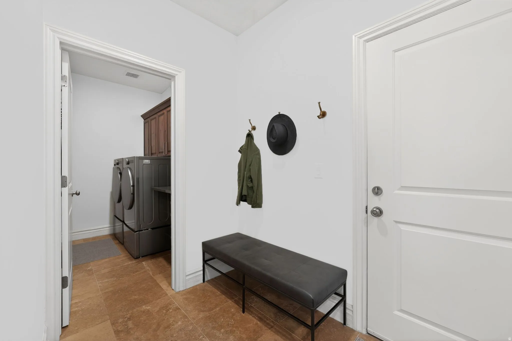 Laundry area featuring cabinet space