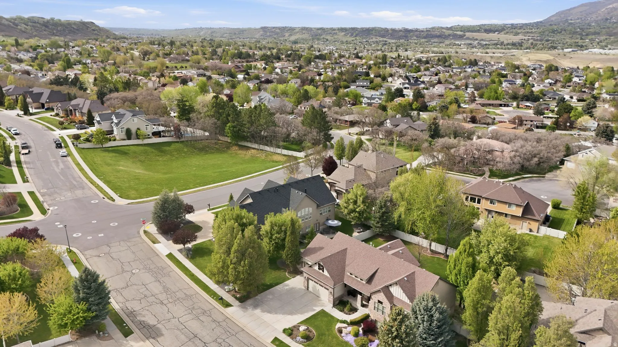 Aerial perspective of suburban area with a mountainous background