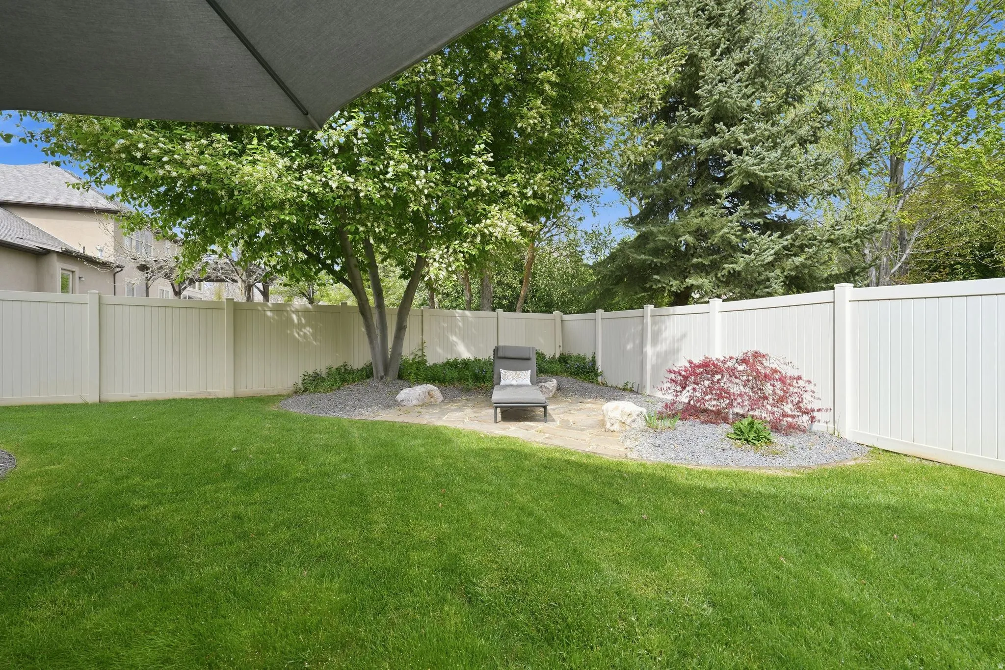 Fenced backyard featuring a patio