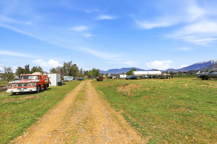 View of dirt / gravel road featuring a mountain view