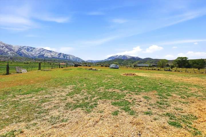 View of yard featuring a view of rural / pastoral area and a mountain view