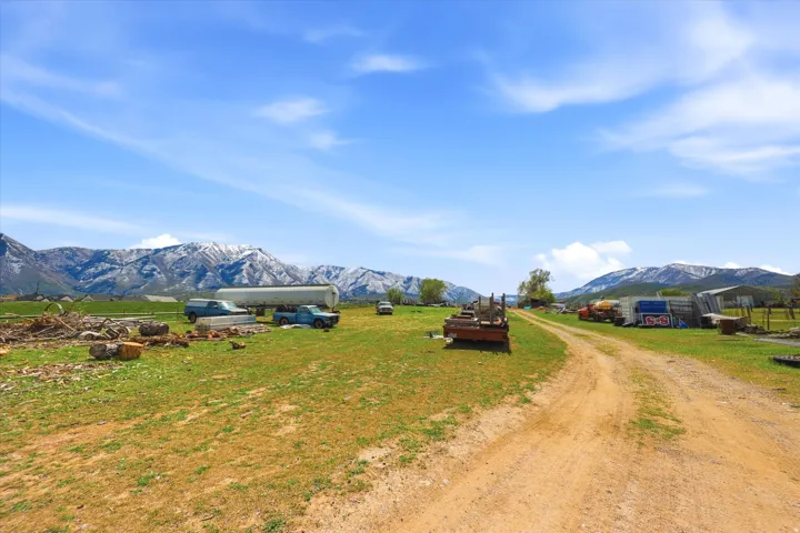 View of dirt / gravel road with a mountain view