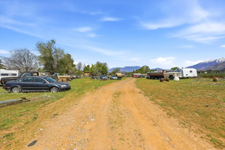 View of dirt / gravel road featuring a mountain view
