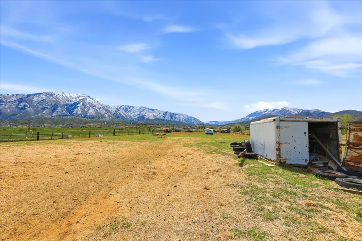 View of mountain backdrop with rural landscape and agricultural land