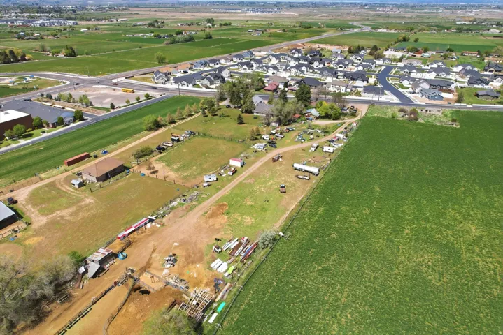 Aerial view of property's location with nearby suburban area