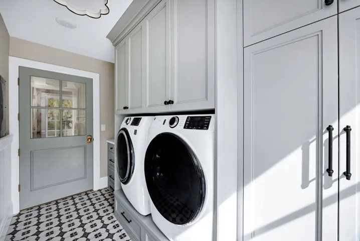 Laundry room featuring cabinet space and washer and clothes dryer