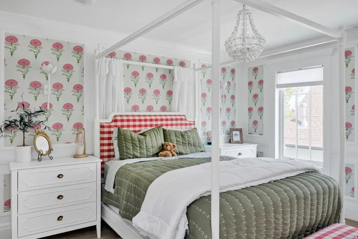 Bedroom featuring crown molding, wallpapered walls, and hanging lights