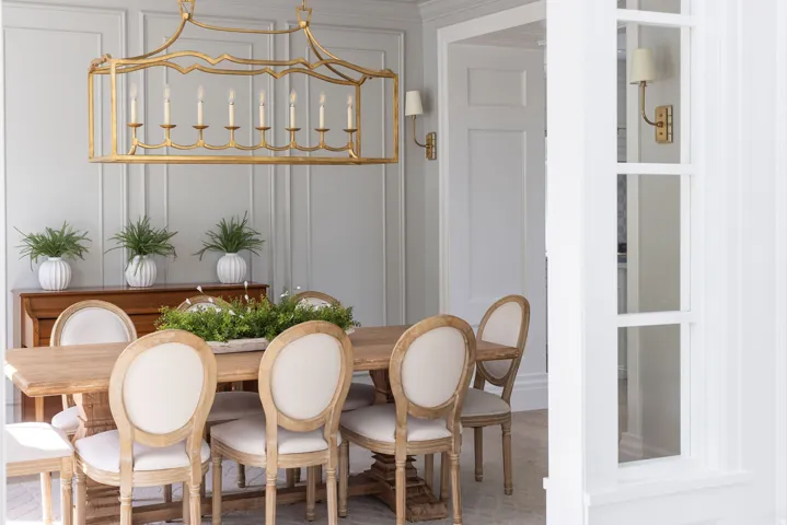 Dining room featuring wood finished floors and a decorative wall